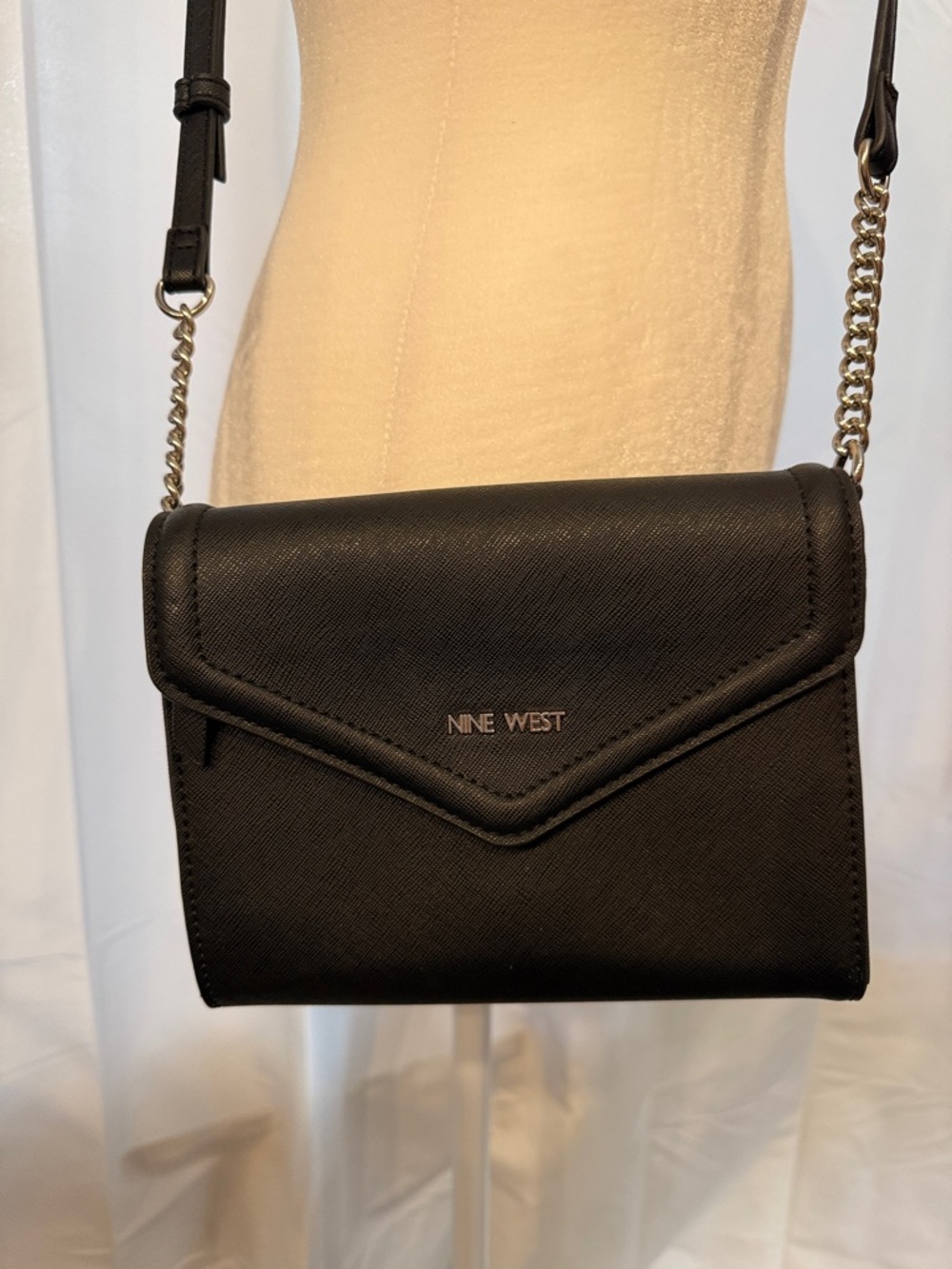 Nine West Elegant Black Crossbody Bag with silver tone hardware.